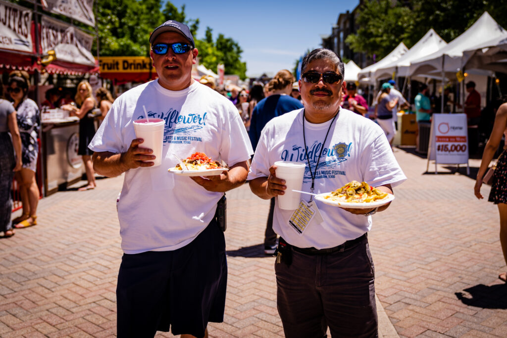 Wildflower! Arts & Music Festival volunteers with food 